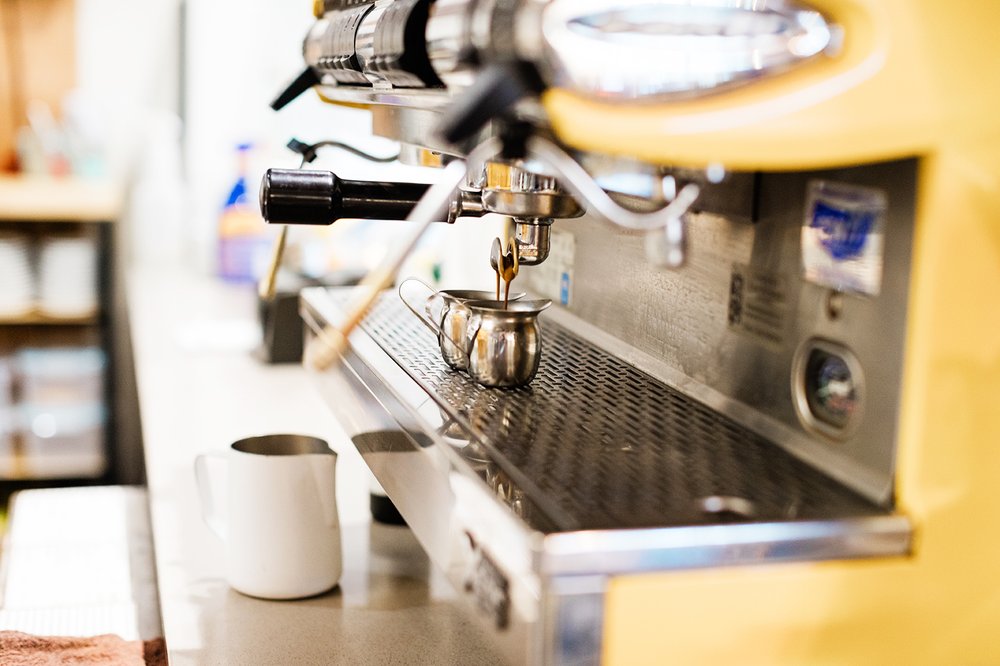 yellow espresso machine with espresso shots for brand portfolio