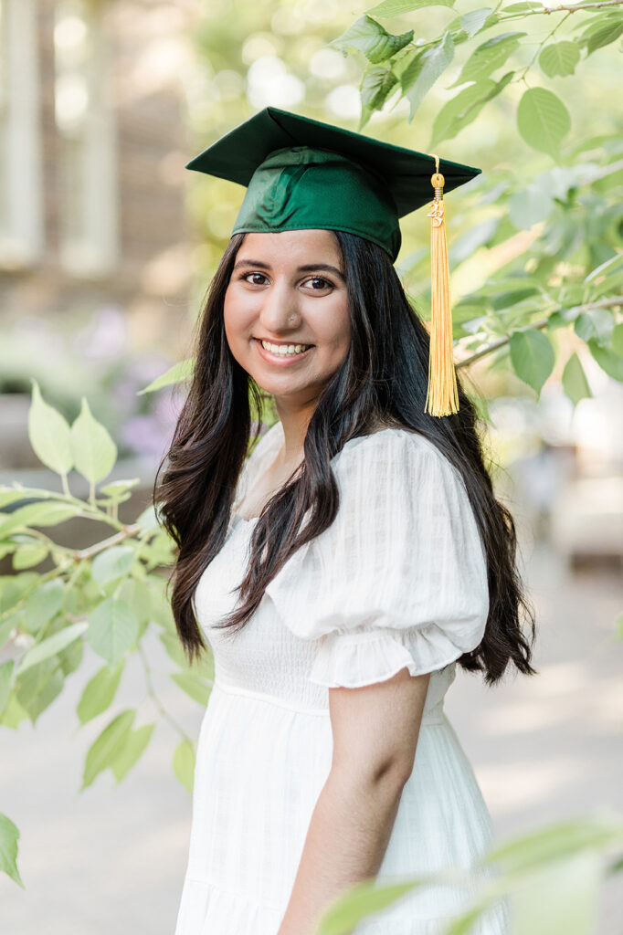 University of Oregon graduate in green cap Eugene girl