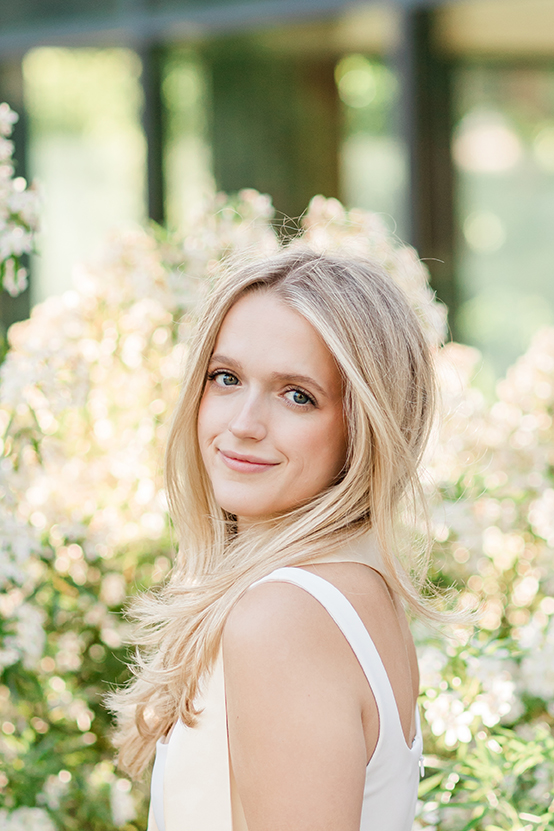 Eugene Oregon girl with white flowers in background